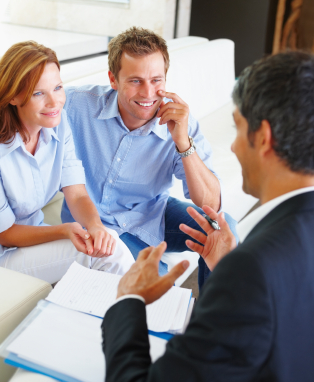 A young couple consulting a financial planner at home